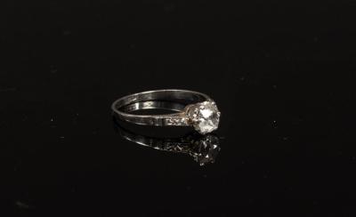 A diamond solitaire ring, the cushion-shaped