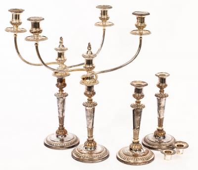 Four Sheffield plated candlesticks