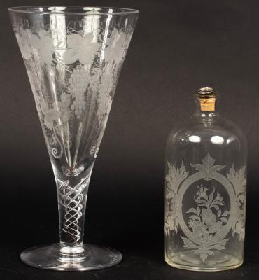 A large glass etched with grapes and