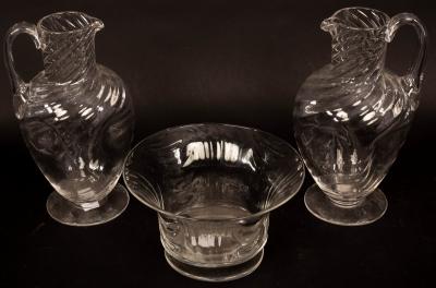 A pair of glass ewers, 21cm high and