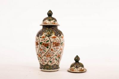 A Chinese jar and cover and a matching