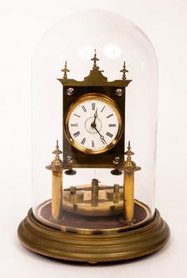 A brass torsion clock, the 2 white