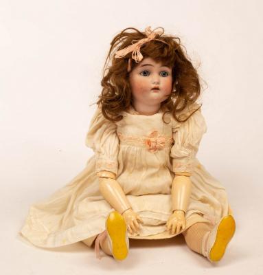 A porcelain headed doll by Simon