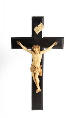 A resin crucifix, the carved figure