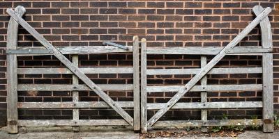 A pair of five-bar cranked teak gates