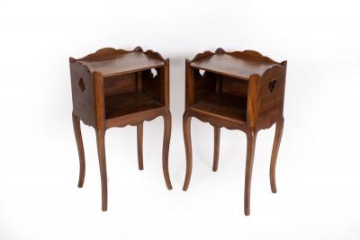 A pair of mahogany bedside cupboards