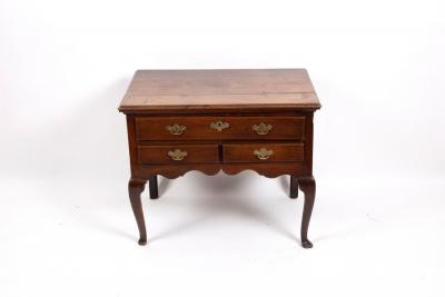 A George III oak lowboy with rectangular