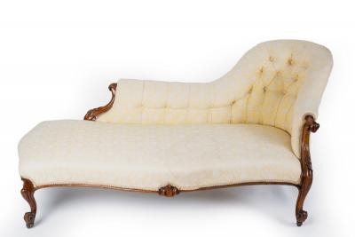 A Victorian walnut framed chaise