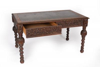 A Victorian oak writing table with 2dc65b