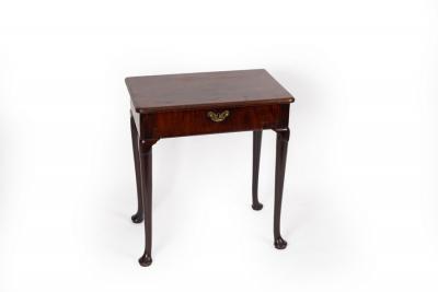 A Georgian mahogany side table fitted