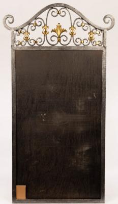 A wrought iron mirror frame (mirror