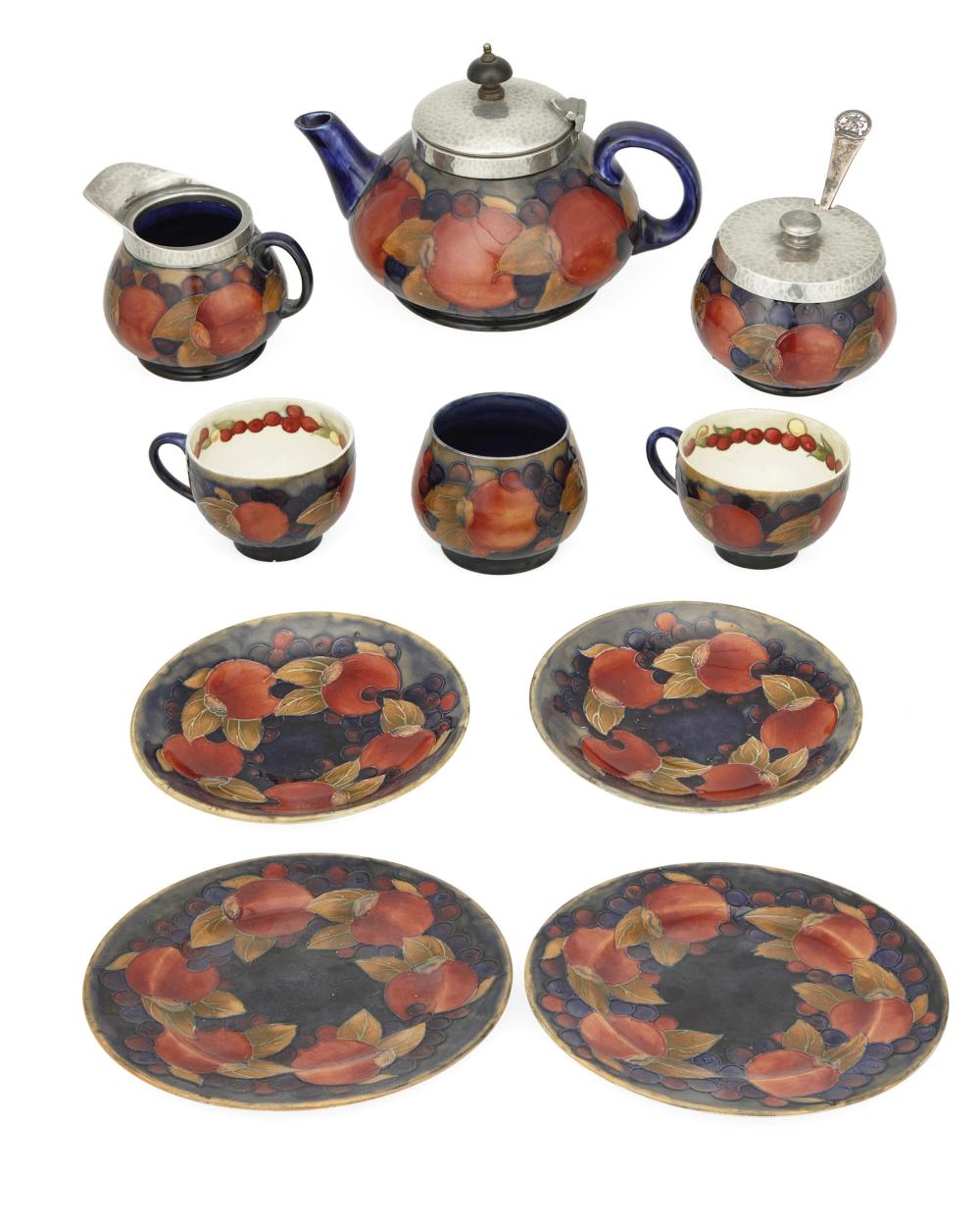 A GROUP OF MOORCROFT POTTERY TABLE