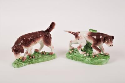 Two Derby style models of hunting dogs,