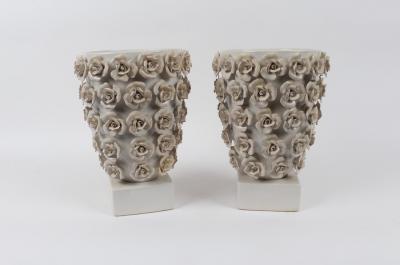 A pair of white glazed planters, each