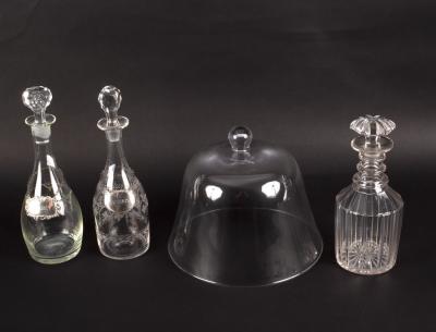 Three glass decanters, two with silver