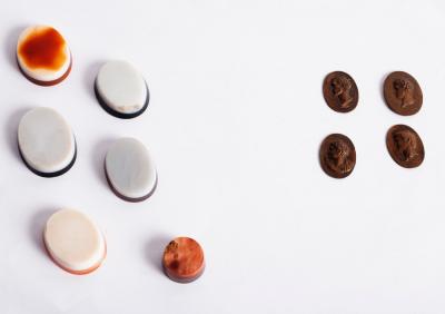 A collection of five oval semi-precious