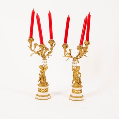 A pair of ormolu three-branch,