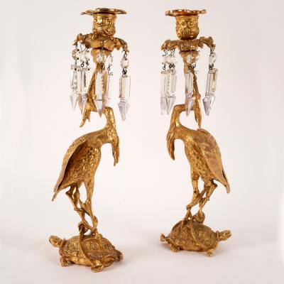 A pair of gilt metal figural candlesticks,