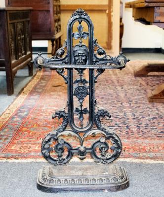 A cast iron umbrella stand, with