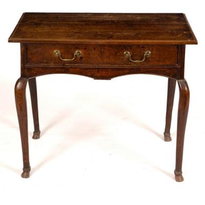 An 18th Century oak table, fitted