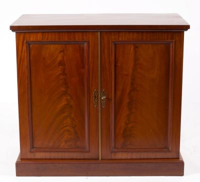 A mahogany cupboard enclosed by