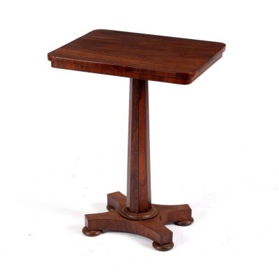 A Victorian rosewood table on an