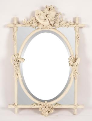 A white painted segmented mirror,