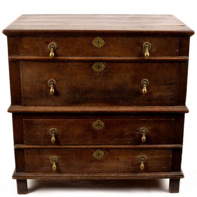 A Jacobean oak chest of four long 2dd837