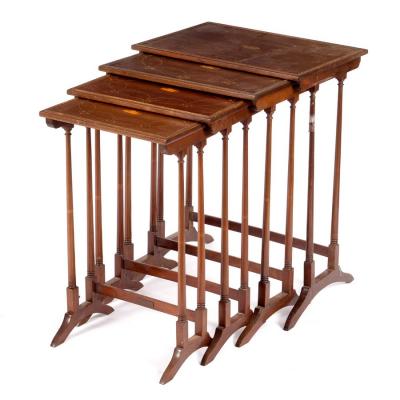 A nest of four mahogany tables with