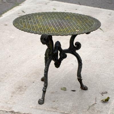 A pierced cast iron garden tabletop