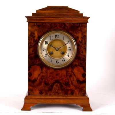 A walnut cased bracket clock, the silver