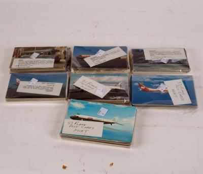 A quantity of postcards, planes and