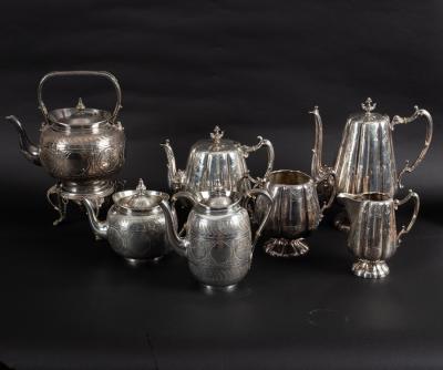 A silver plated tea kettle, the matching