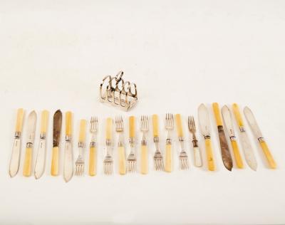Nine pairs of fish knives and forks