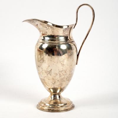 An Edwardian ovoid form silver jug,