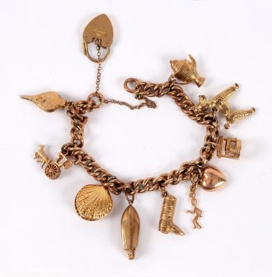 A 9ct gold charm bracelet with 2dda10