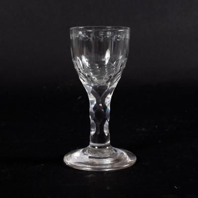 An 18th Century cordial glass with facet