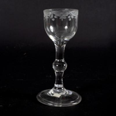 An 18th Century cordial glass with knopped