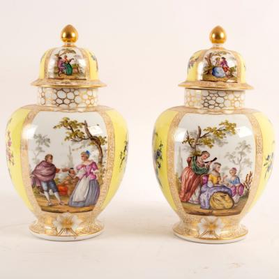 A pair of Dresden jars and covers,