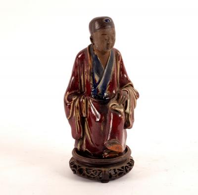 A Chinese stoneware figure of a