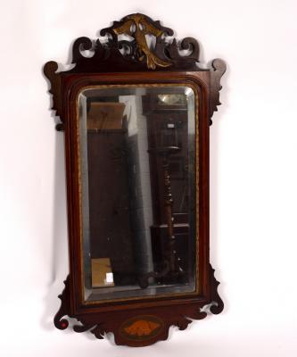 A mahogany wall mirror, the frame