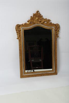 A decorative gilt framed wall mirror