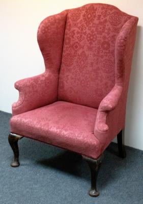 An 18th Century style wing armchair,