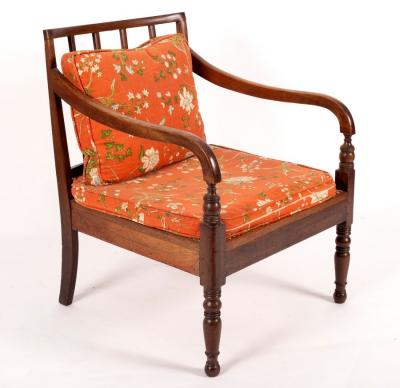 A Regency open arm chair with cane seat,