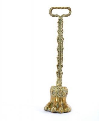 A brass hair claw door porter with