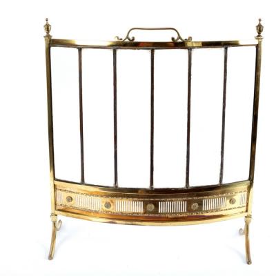 A brass and glass fire screen on splay