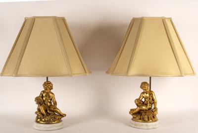 A pair of table lamps with gilt putto