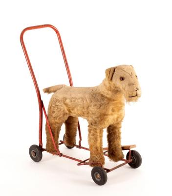 A toy push-a-long mohair dog, by