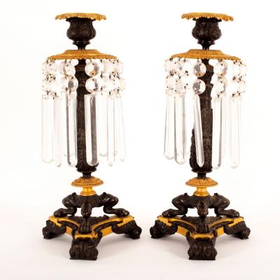 A pair of Empire lustre candlesticks
