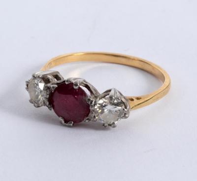 A ruby and diamond three-stone